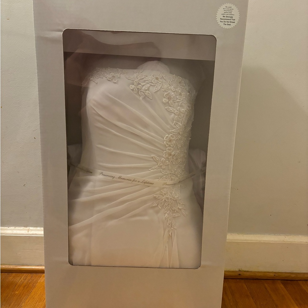 This beautiful dress was only worn once and then professionally cleaned.